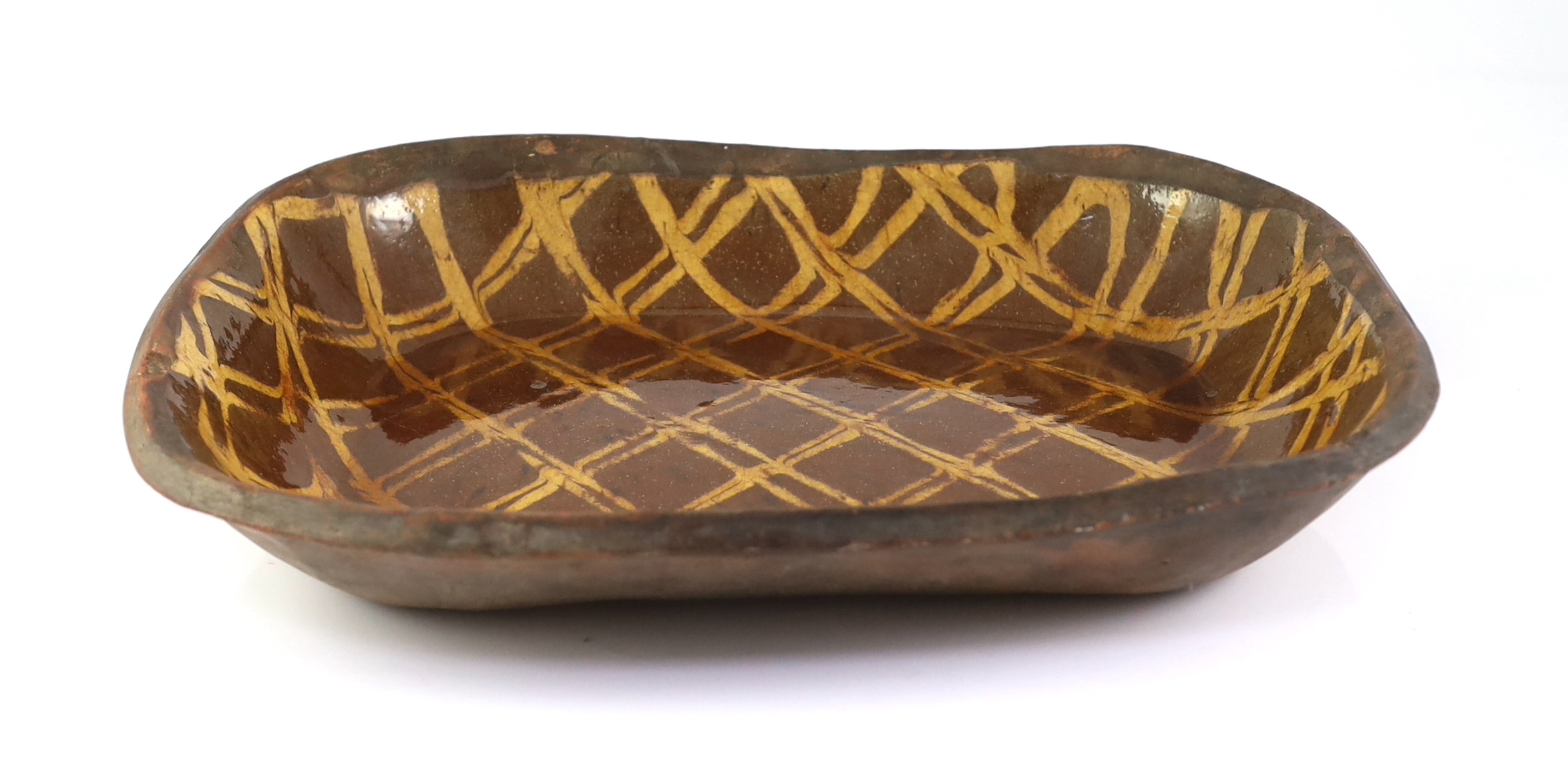 An English or Welsh slipware baking dish, late 18th/early 19th century